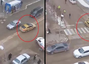 Taksisini bağlamak isteyen polisi metrelerce sürükledi
